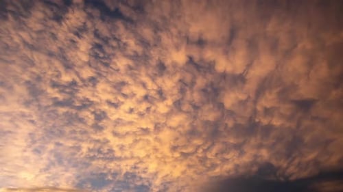 Time lapse of colorful clouds at sunset changing colors