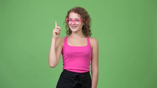 Young Woman With Idea Points Upward