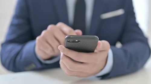 Close Up Businessman Using Smartphone