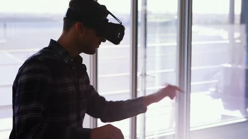 Man Wearing VR Headset in Modern Office