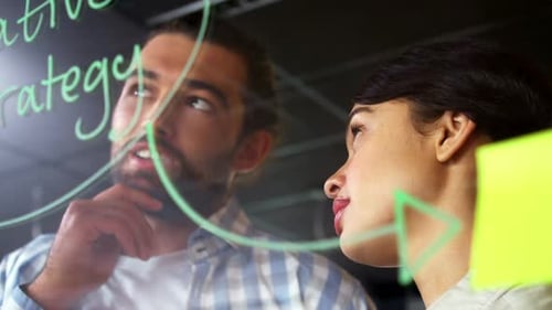 Colleagues Collaborating on Creative Strategy in Office