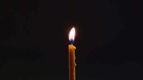 Candle Is on and Goes Out. Black Background. Close Up