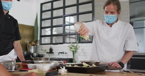 Chefs Preparing Food in a Commercial Kitchen