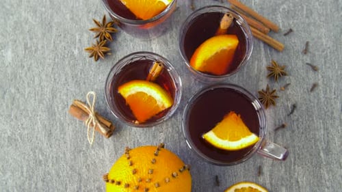 Glasses of Hot Mulled Wine with Orange and Spices