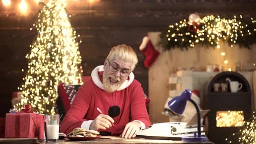 Festive Man Writes Letter in Decorated Christmas Room