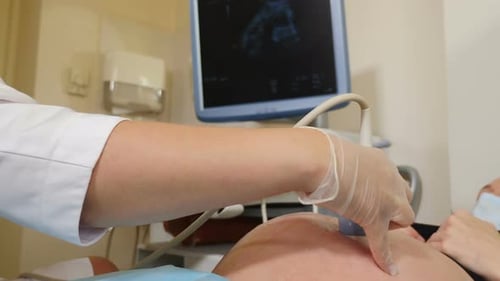 Pregnant Woman Getting Ultrasound Examination in Clinic