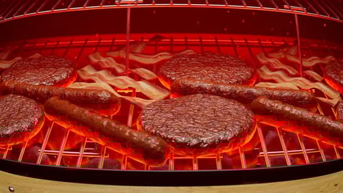 Grilling meat. Barbeque. Steaks, sausages, burgers. Grill with red hot charcoal.