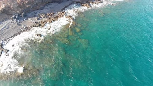 portrait of Aerial footage of shore and beach of Jacomar - Fuerteventura