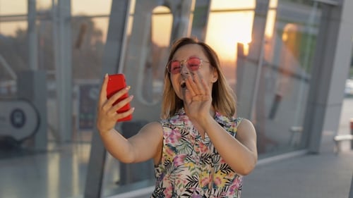 Woman on Video Call at Sunset