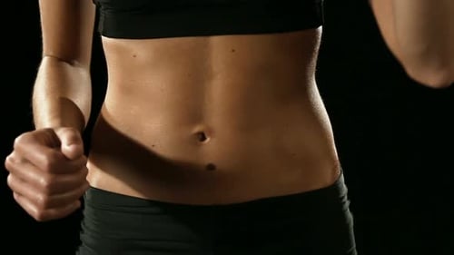 Athletic Woman Opens Water Bottle in Close Up