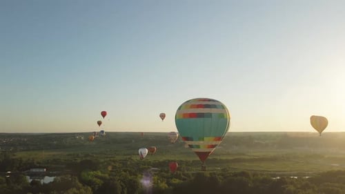 Colorful Hot Air Balloons Ascend at Sunrise
