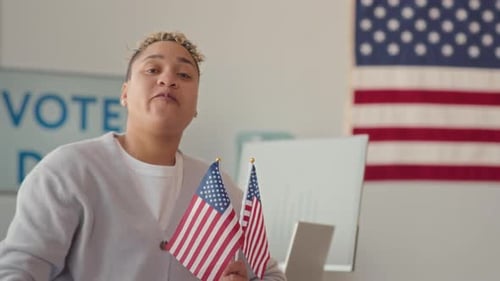 Biracial Woman with Voting Sticker at Electoral District