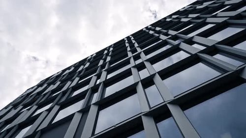 Abstract and Complex Blue Skyscraper Structure Downtown in Montreal with Sky in Background