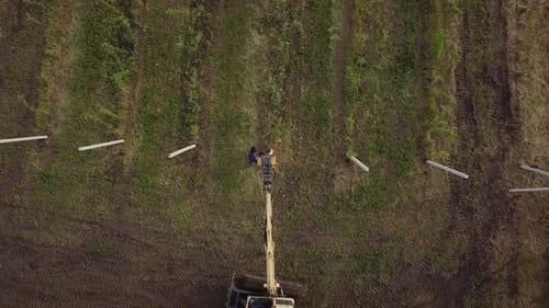 Aerial View of Field with Construction Vehicle