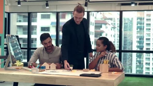 Creative Business People Group Having Conversation at Office Desk in Workplace