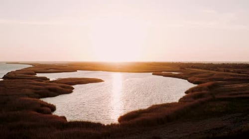 Aerial Landscape View of Beautiful Lake Among Grass Flowing Into Black Sea in the Evening Against
