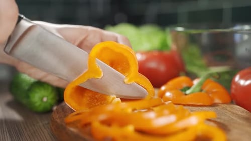 Slicing Orange Bell Pepper With a Knife