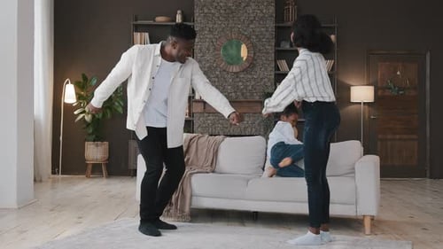 Family Dancing Together in Living Room