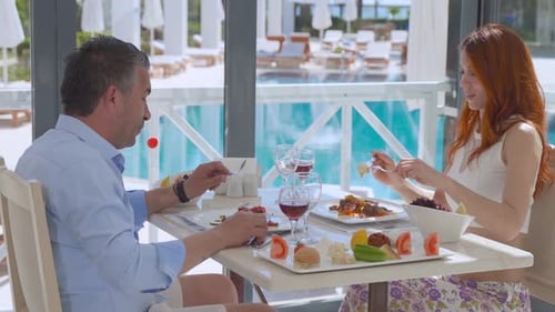 Romantic young couple eating.