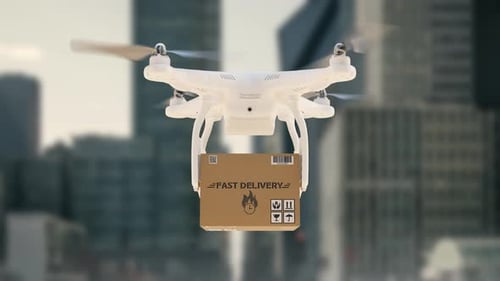 Delivery Drone Hovering with Package in Urban Setting