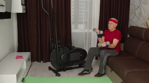 Senior Man Working Out with Dumbbells at Home