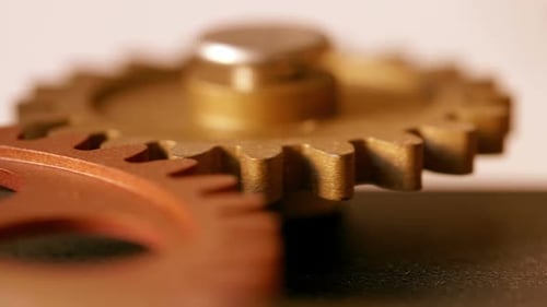Rotating Metallic Gear Wheels Meshing Together