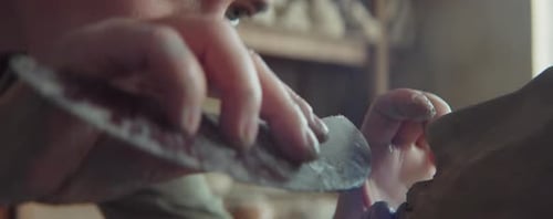 Close Up of Artist Shaping Clay Sculpture