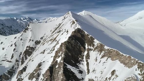Aerial View of Snow-Covered Mountain Peaks