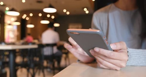 Using smart phone in the coffee shop