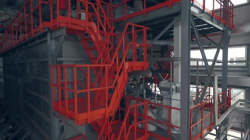 Indoor orange ladders on a wheat mill. Aerial view 02