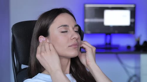 Close Up Woman Head with Earphones Listening to Music at Neon Background