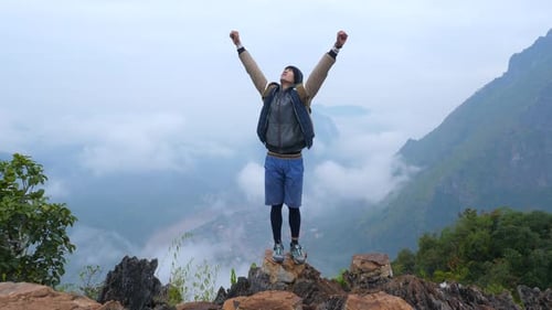 Successful Hiker Hiking On Mountain Peak