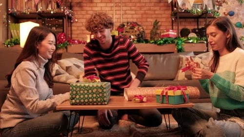 Friends and Gift Wrapping at Home During Christmas