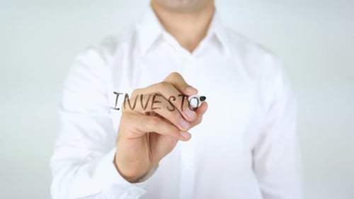 Writing Investor on Clear Surface