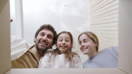Happy Family Surprised with Gift Inside Box