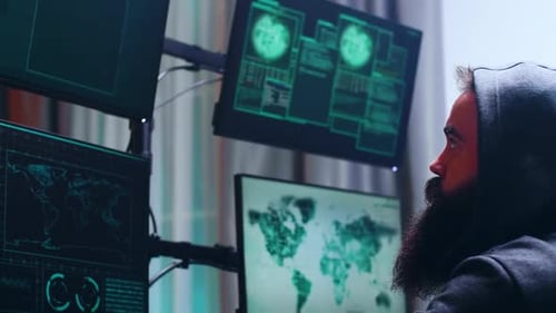 Side View of Bearded Cyber Terrorist Wearing a Hoodie