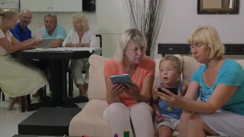 Family Using Technology in Living Room