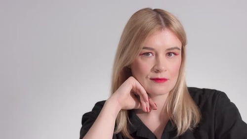 Blonde Woman with Bright Red Makeup in Studio