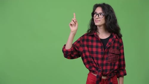 Smiling Woman has Idea in Front of Green Screen