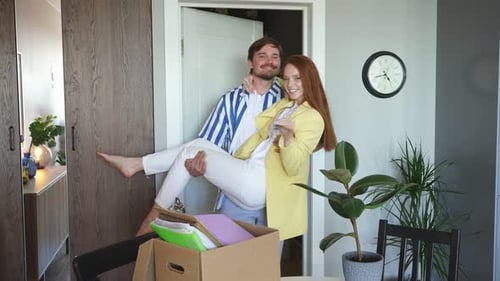 Affectionate Couple Celebrating Moving into New Home
