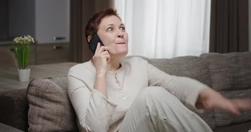 Woman Celebrates Good News on the Phone