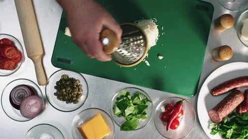 Using Grater when Making Pizza