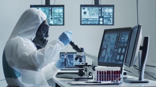Scientist Examining Blood Sample in Secure Lab