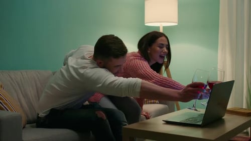 Couple Making Online Video Call Toasting with Wine