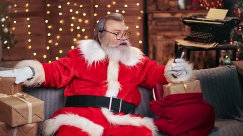 Santa Claus Using Smartphone For Video Call