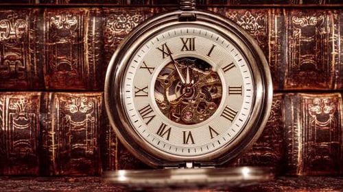 Antique Pocket Watch with Books in Close-Up