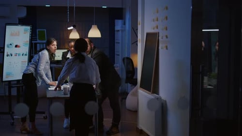 Team Collaboration in Urban Workspace at Night