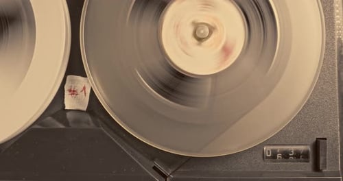 Vintage Reel-to-Reel Tape Recorder in Operation