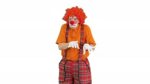 Clown in Costume Gesturing on White Background