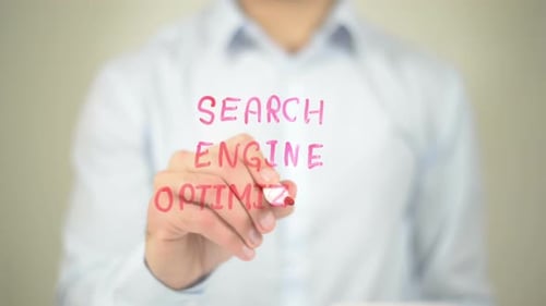 Hand Writes Search Engine Optimization on Glass